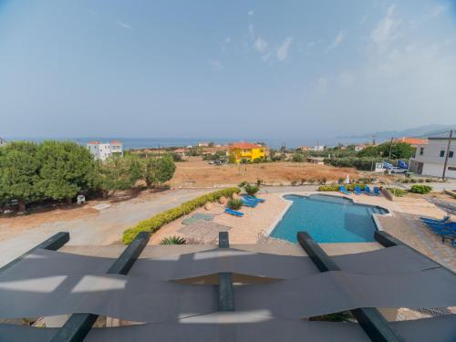 a view of a swimming pool at a resort at Apartments Hotel & Studios, Xifoupolis in Monemvasia