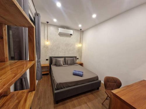Ένα ή περισσότερα κρεβάτια σε δωμάτιο στο TimeOut Apartment