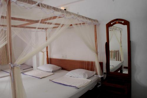 Postel nebo postele na pokoji v ubytování Hansa Surf Hotel