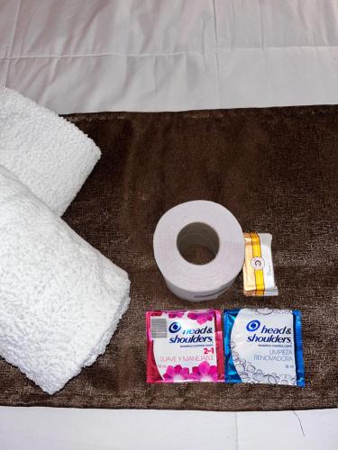 a close up of a toilet paper and a towel at Hotel Casahuanca Olimpico in Huancayo