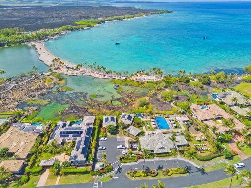 an aerial view of a resort near the beach at Hilton Pool Pass Included, Kolea - Stylish & Comfy Walk to Beach Patio Pool Gym in Waikoloa