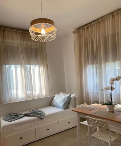 a living room with a couch and a table at Mentana Guest House in Parma