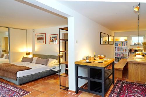 a bedroom with a bed and a desk in a room at Hotel Zur Linde Dein Self Check In in Michendorf