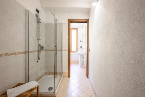 a bathroom with a shower and a bath tub at Emilia Studios in Modena