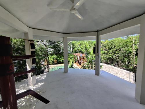 a view from the living room of a house with a ceiling fan at Tu Departamento en Mahahual in Mahahual