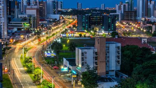 a city lit up at night with street lights at Profissionalle Hotel São Luís in São Luís