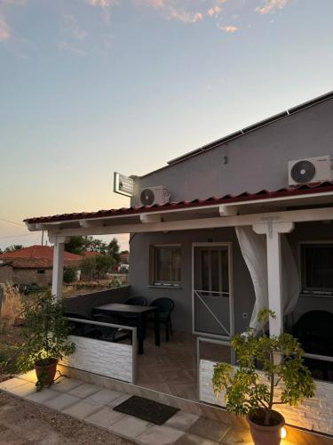 a house with a patio with a roof at Imeros house 3 in Ímeros