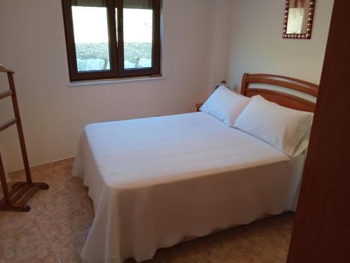 Ένα ή περισσότερα κρεβάτια σε δωμάτιο στο Apartamento Vistas al MAR