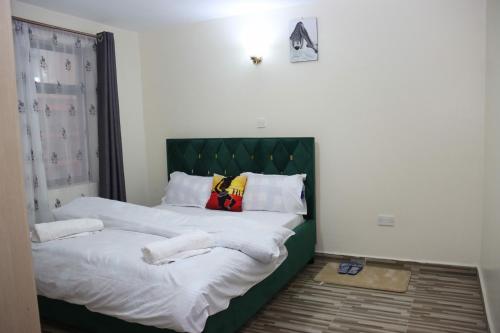 Postel nebo postele na pokoji v ubytování Nikita Holiday Homes