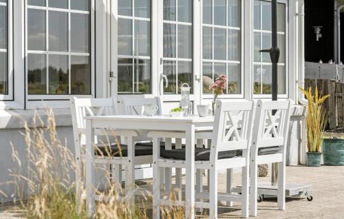 a white table and chairs on a patio at Stunning Home In Ulfborg With Wifi in Ulfborg