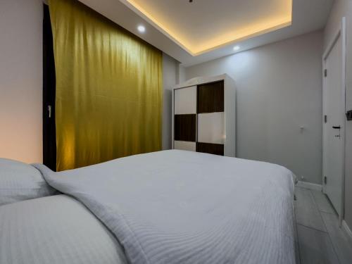 Ένα ή περισσότερα κρεβάτια σε δωμάτιο στο Tunç Suite Luxury House