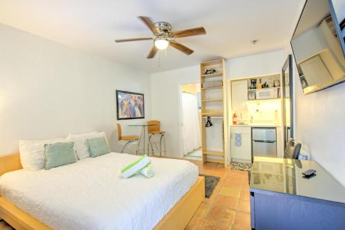 a bedroom with a bed and a ceiling fan at Efficiency 2 on water Las Olas, beach and free kayaks in Fort Lauderdale
