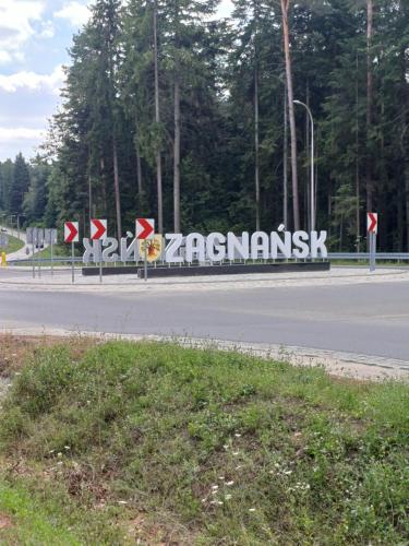 a sign on the side of a road at Chata Leśna in Zagnańsk Siodła