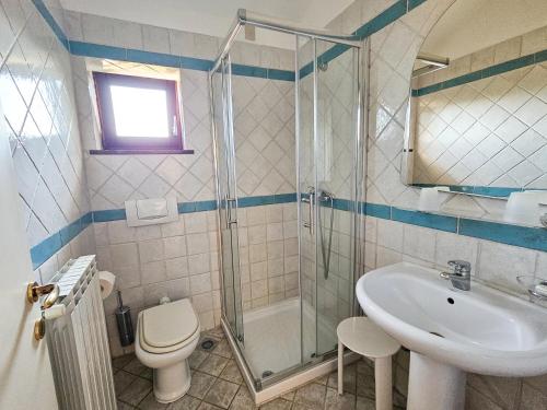 a bathroom with a shower and a toilet and a sink at Rooms Tanja Lovran in Lovran