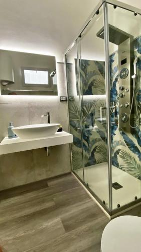 a bathroom with a sink and a shower at Sicily Casa Vacanze in Cassibile
