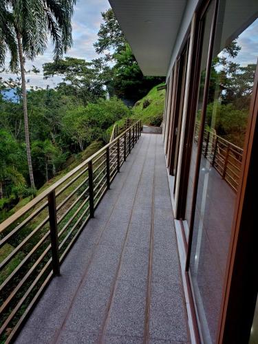 a balcony of a building with a walkway at Suite vista hermosa apartament in Macas
