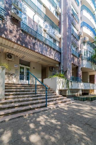 a building with stairs in front of a building at Zebrano Spa in Novi Beograd