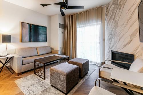 a living room with a couch and a fireplace at Condos at Canyons Resort by White Pines in Park City