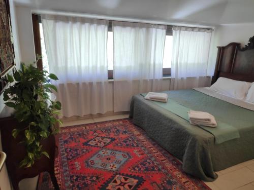 Ένα ή περισσότερα κρεβάτια σε δωμάτιο στο Casa di Rita