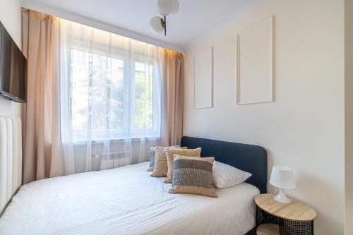Postel nebo postele na pokoji v ubytování Apartament Przyjemny, Klimatyzacja, PW INVEST HOME