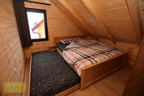 Postel nebo postele na pokoji v ubytování Bujtinat Lisa