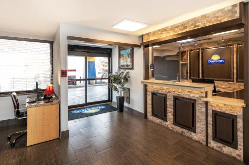 an office with a lobby with a kitchen and a desk at Days Inn by Wyndham Fort Smith in Fort Smith