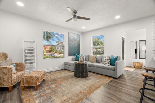 a living room with a couch and chairs at NEW! SoHo Oasis - Incredible Home In Heart of SoHo District in Tampa