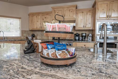a kitchen with a counter with some food on it at Sunset Mountain Hot Tub, Fire Table, Epic Views in Shaver Lake