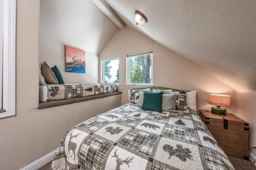 a bedroom with a bed and a window at Sunset Mountain Hot Tub, Fire Table, Epic Views in Shaver Lake