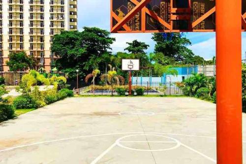an empty basketball court with a basketball hoop at KH Rentals - near Mactan Airport in Lo-oc