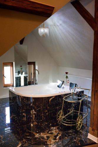 a kitchen with a large island in a room at Turmhaus Hermannstadt in Sibiu