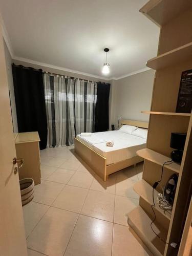 Gulta vai gultas numurā naktsmītnē Seaside Apartment