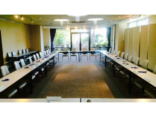 a conference room with long tables and chairs at Fuji Park Hotel - Vacation STAY 23861v in Fuji