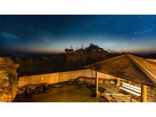 a starry night with a pool of water next to a building at Goto Conkana Kingdom - Vacation STAY 25614v in Goto