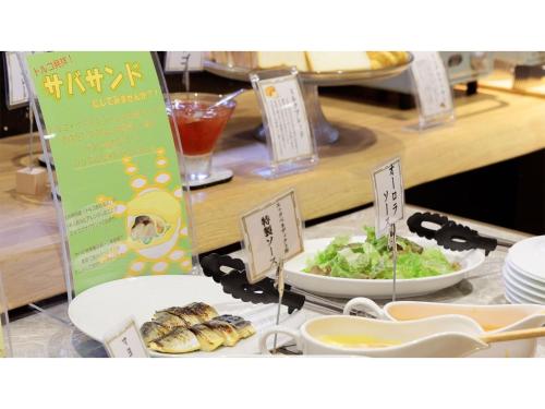 a table with a buffet with food on it at Hotel Flags Isahaya - Vacation STAY 25620v in Isahaya