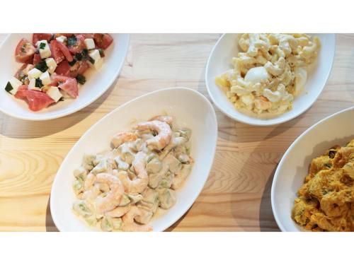a group of plates of food on a table at Hotel Flags Isahaya - Vacation STAY 25620v in Isahaya