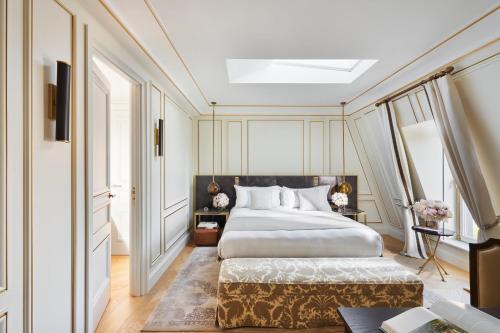 a bedroom with a large bed and a window at Mandarin Oriental Ritz, Madrid in Madrid