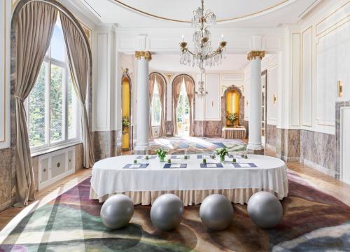 a large room with a large table in the middle at Mandarin Oriental Ritz, Madrid in Madrid
