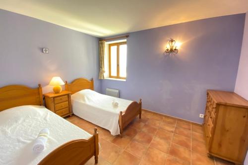 a bedroom with two beds and a window at 04B3 Beautiful T3 in the heart of lavender - pool in Brunet