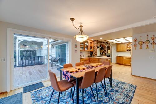 a kitchen and dining room with a table and chairs at Spacious Grants Pass Home with Hot Tub and River Views in Grants Pass