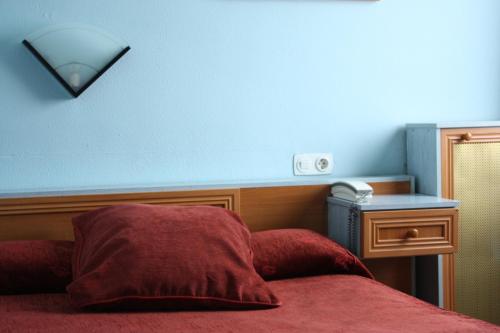 Кровать или кровати в номере Hotel Rausan