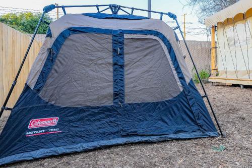 a tent is set up on the ground at Urban Oasis Luxe Glamping with King Bed & BBQ in Glendora