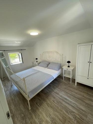 Postel nebo postele na pokoji v ubytování Balatura House