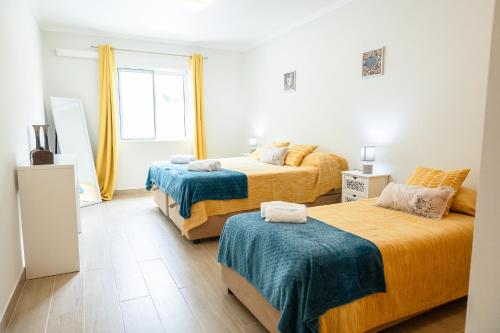 Postel nebo postele na pokoji v ubytování Marina Mar Vila Franca do Campo