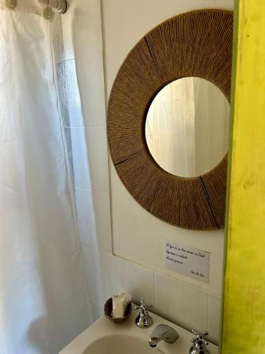 a bathroom with a mirror and a sink at Casa San José in Cachí