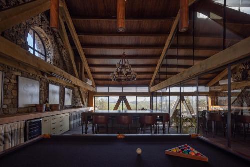 a billiard room with a pool table in the middle at Bruma Wine Resort in Valle de Guadalupe