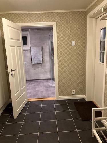 a bathroom with a shower with a glass door at Newly renovated cozy house Urshult-Åsnen-south Småland in Urshult