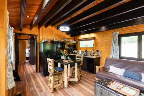 a living room with a couch and a table at Meraki Escape in Brevard