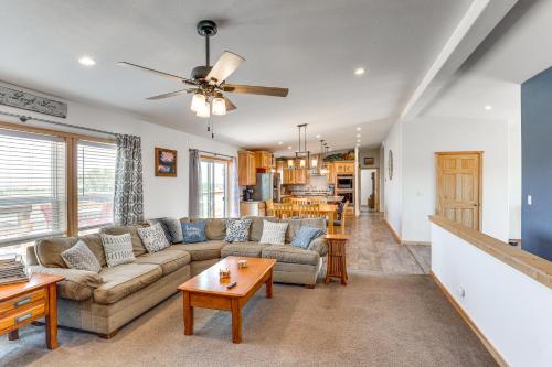 a living room with a couch and a table at Mountain-View Retreat in Lander with Private Yard! in Lander