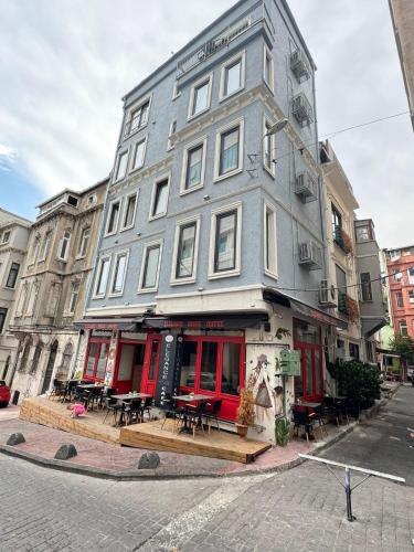 a building on a street with tables in front of it at Elegance House Hotel in Istanbul